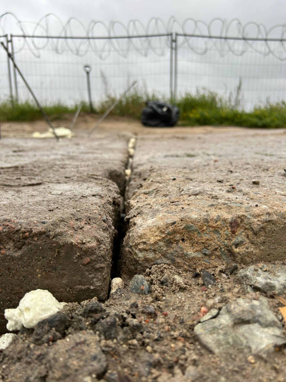 Cracked concrete slab stabilized after geopolymer injection by Geolift
