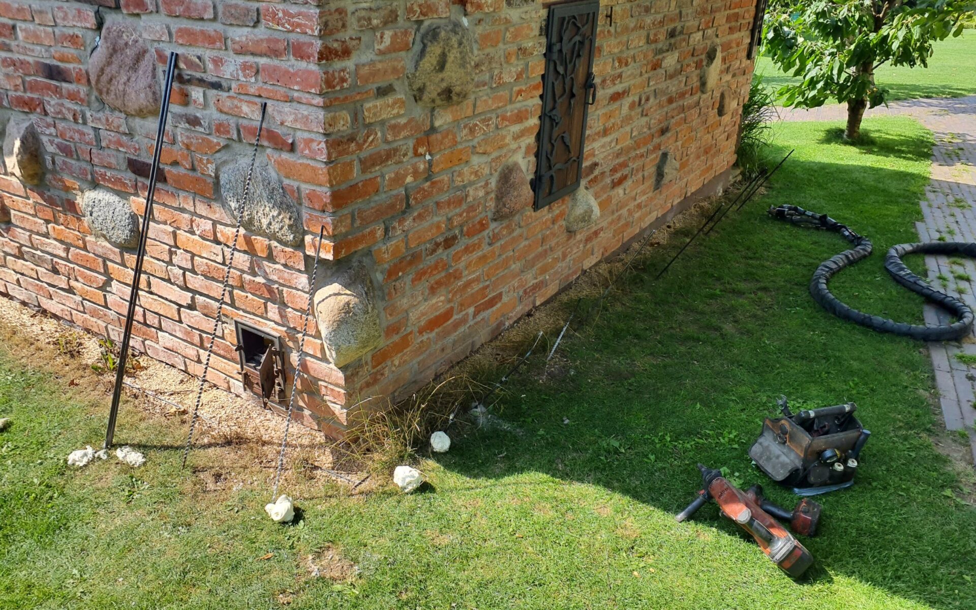 Precision lifting of a historic masonry foundation using controlled geopolymer injection